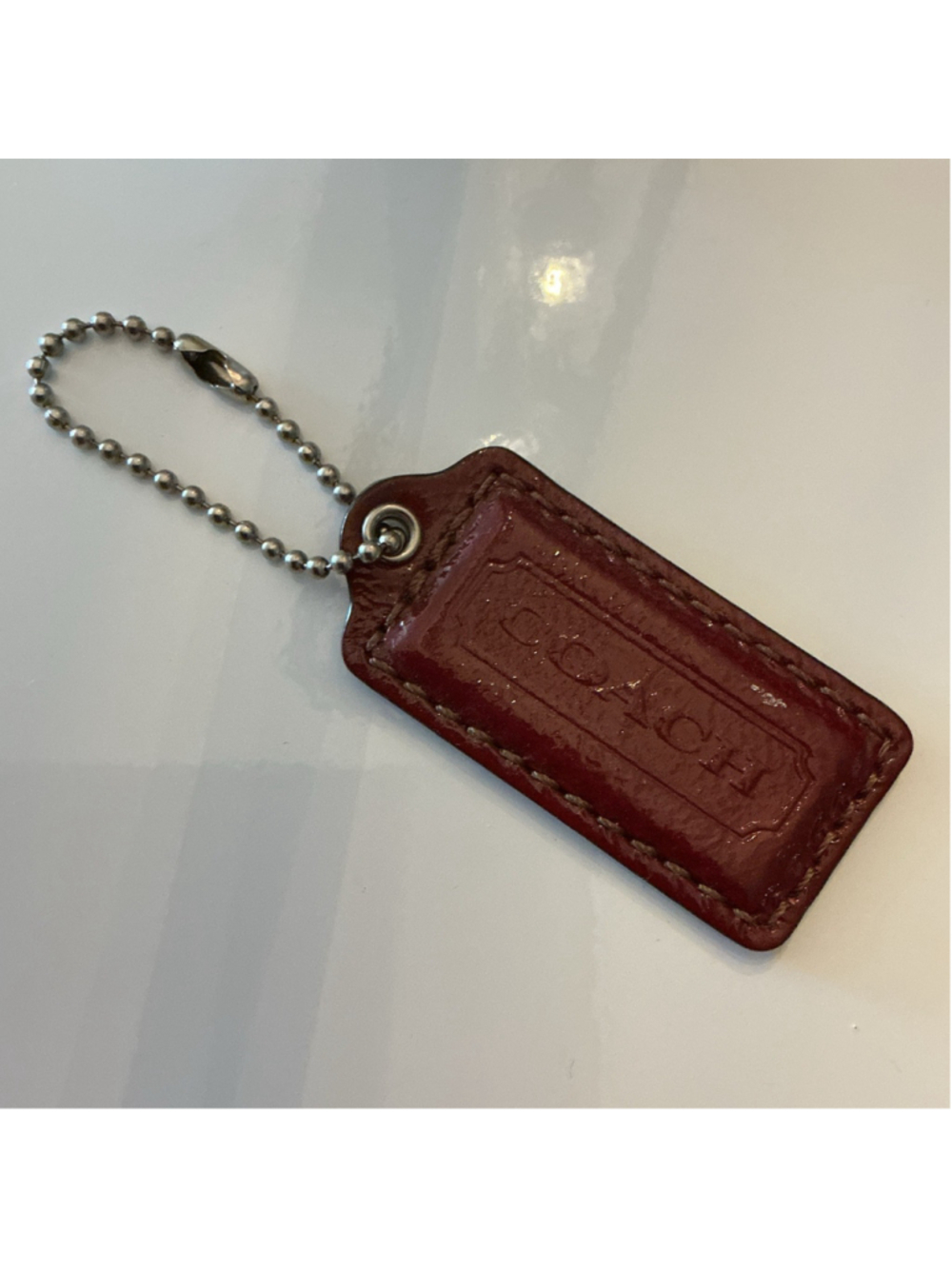 Coach Burgundy Bag Tag